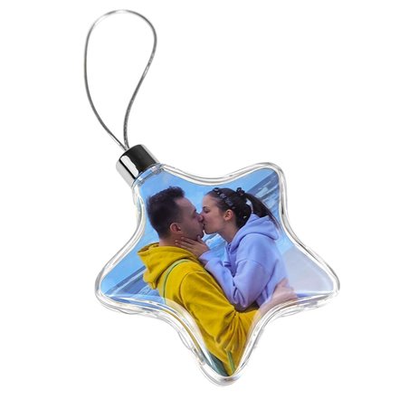 Foto bombka na choinkę w kształcie gwiazdki z dwoma zdjęciami.