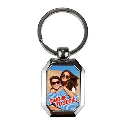 Elegancki ciężki, metalowy, brelok jednostronny.