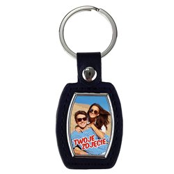 Elegancki ciężki, metalowy, brelok jednostronny ze skórką.