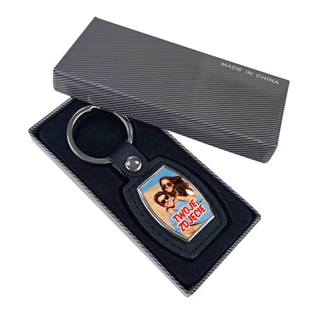 Elegancki ciężki, metalowy, brelok jednostronny ze skórką.