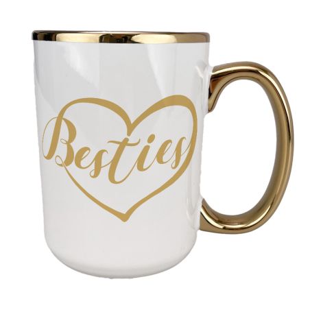 Kubek 450 ml biały ze złotym uszkiem, rantem oraz z grafiką - "Besties"